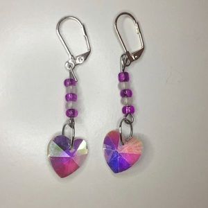 NEVER WORN Iridescent heart charmed earrings.
